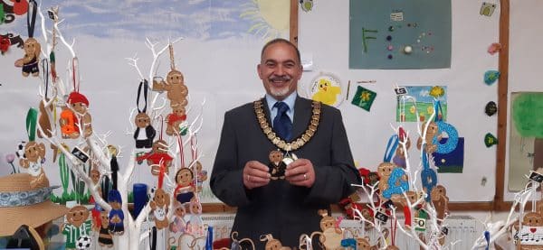 The Town Mayor holding a handmade Gingerbread Man